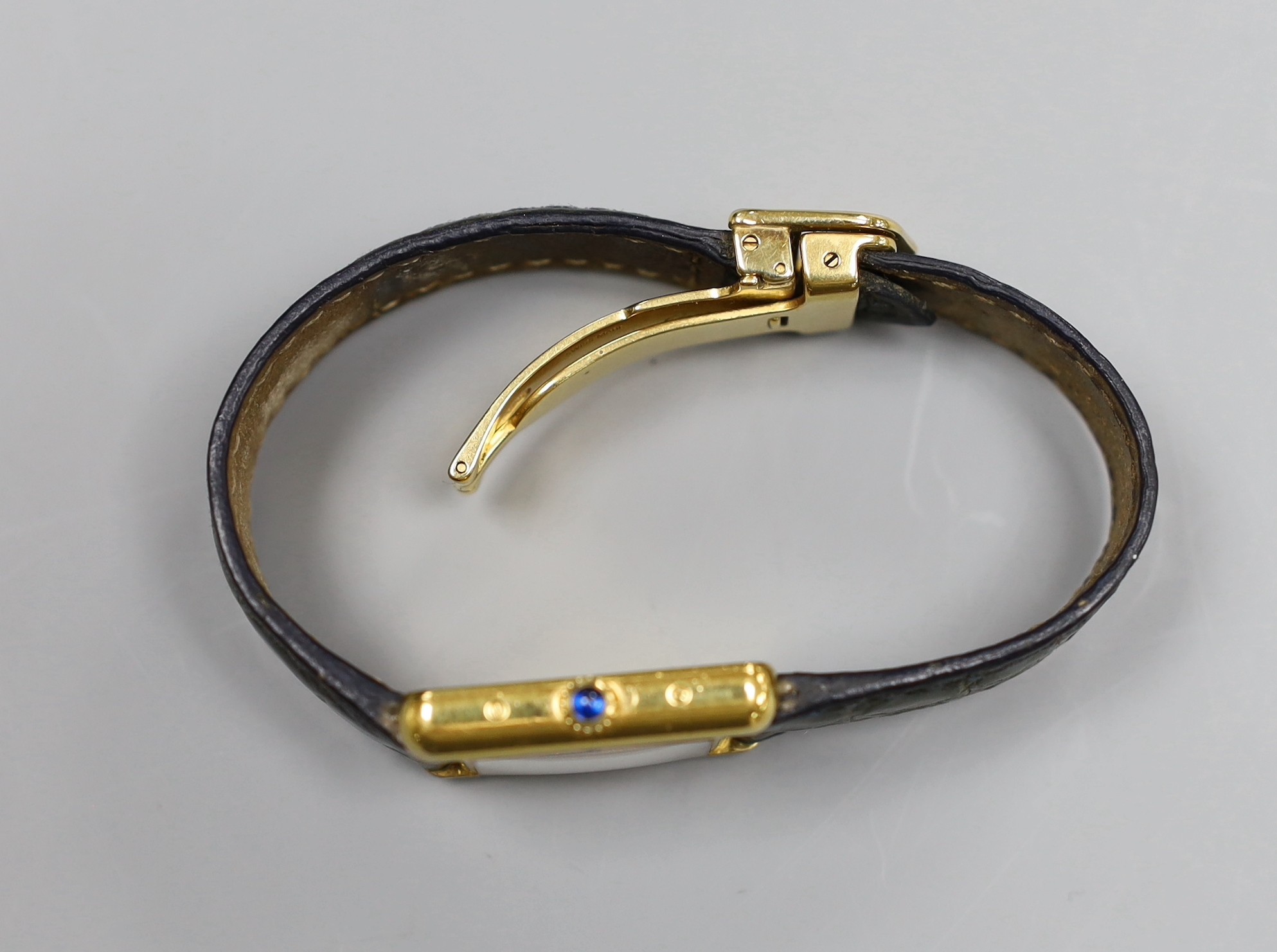 A lady's Must de Cartier silver gilt wristwatch, with quartz movement and blue cabochon winder